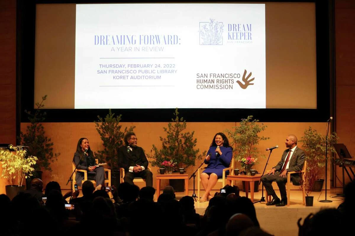 Human Rights Commission Director Sheryl Evans Davis (left) moderates 'Dreaming Forward: A Year in Review' with Cornel West, Mayor of London Breed and Supervisory Board Chairman Shamann Walton in the Koret Auditorium from the San Francisco Public Library.
