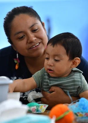 Fabiola Cigarroa and her 13-month-old son Gael recently participated in the Musical Motion program at the Glasser/Shoenbaum Human Services Center in Sarasota.