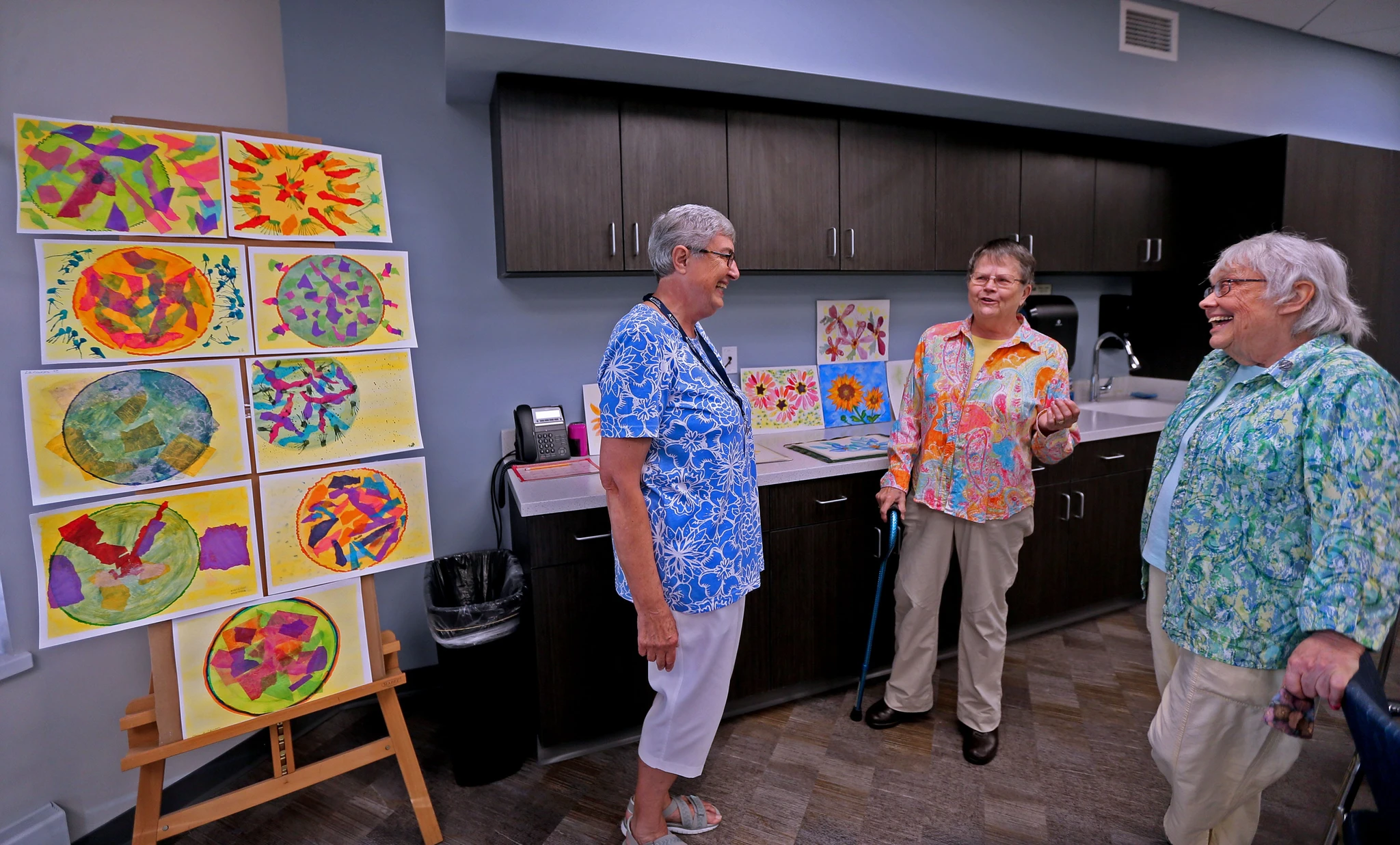 Retired nuns, left to right, Sister Martha Waligora, Sister Susan Ann Adrians and Sister Karen Walther, gather in the fine arts studio at Trinity Woods, intergenerational housing on the campus of Mount Mary University.